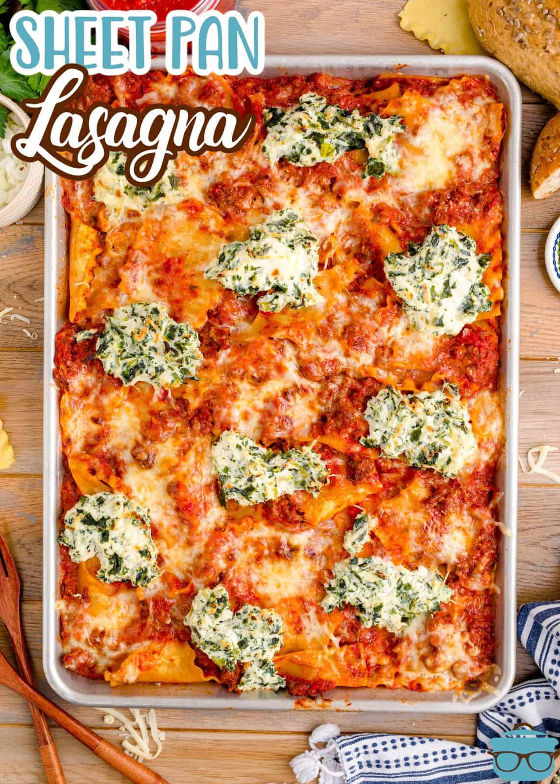 A baking sheet with lasagna in it.
