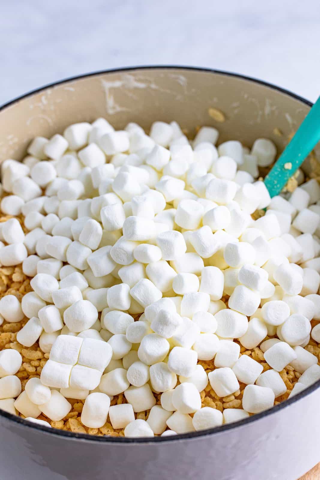 Mini marshmallows on top of cereal and melted marshmallow mixture.