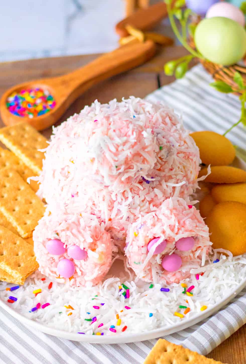 A bunny butt funfetti dip on a plate with crackers and cookies.