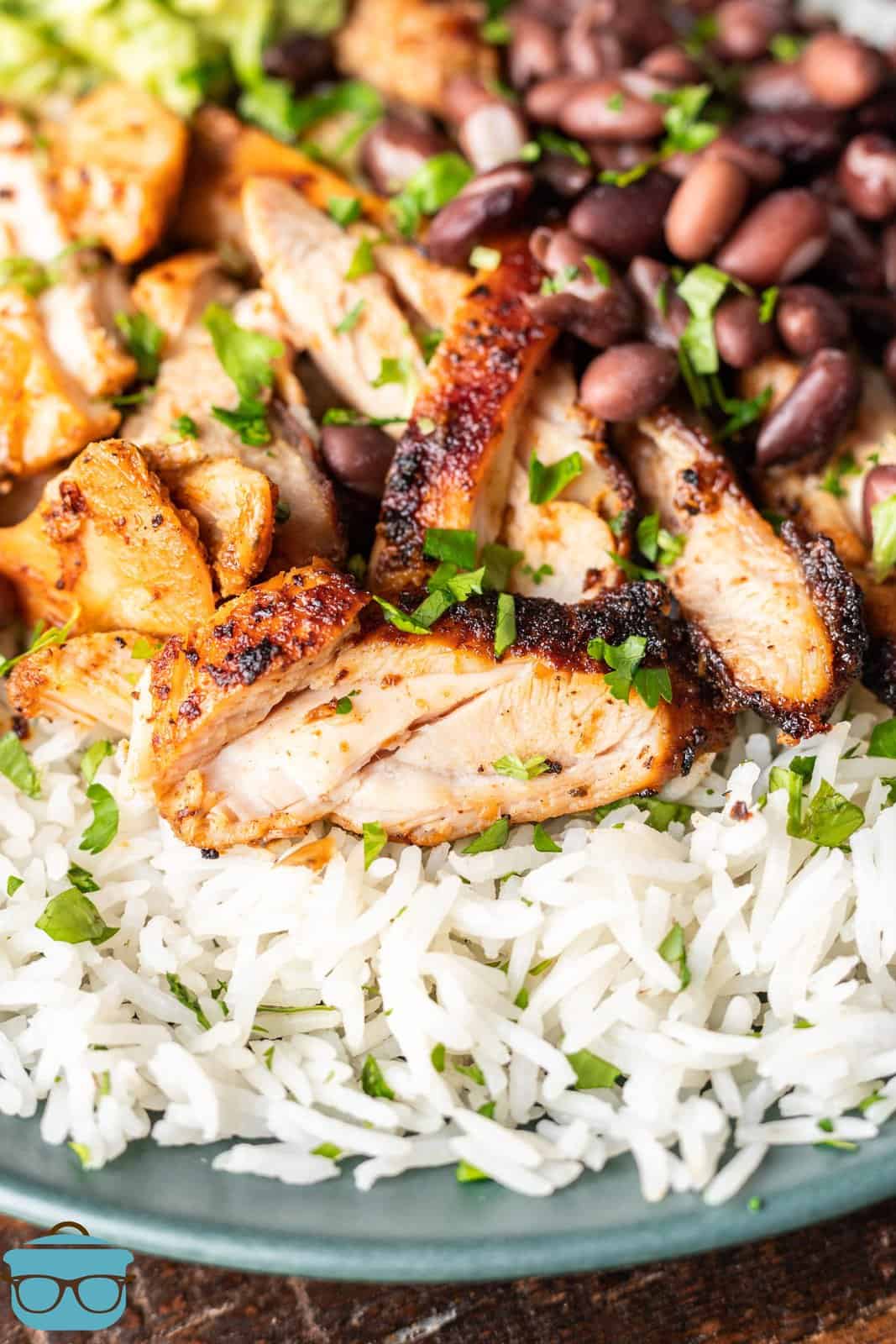 A plate with rice and Chipotle Chicken.
