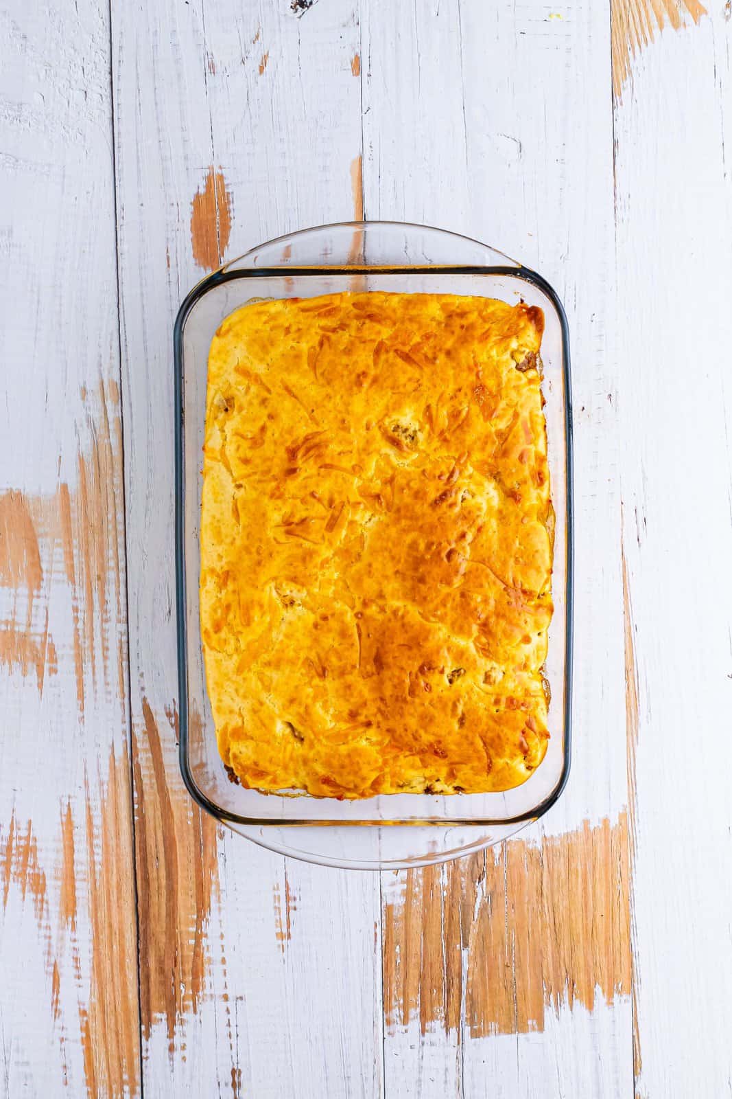 Baking dish with a baked Bisquick taco casserole, without the toppings.