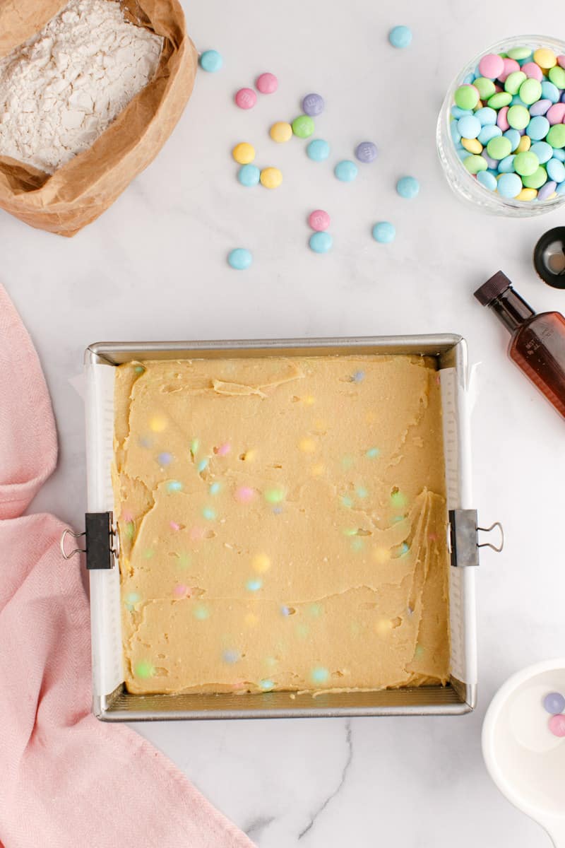 Easter Blondie batter mix spread out on a pan.
