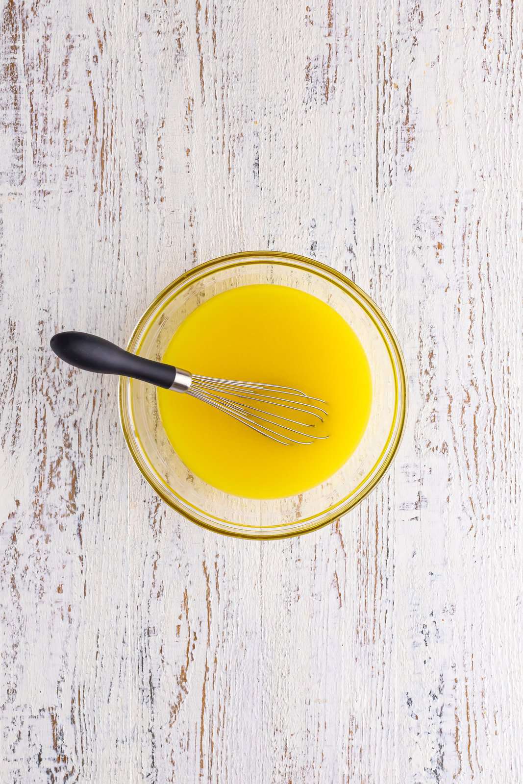 Whisk in a bowl of pineapple jello mix.