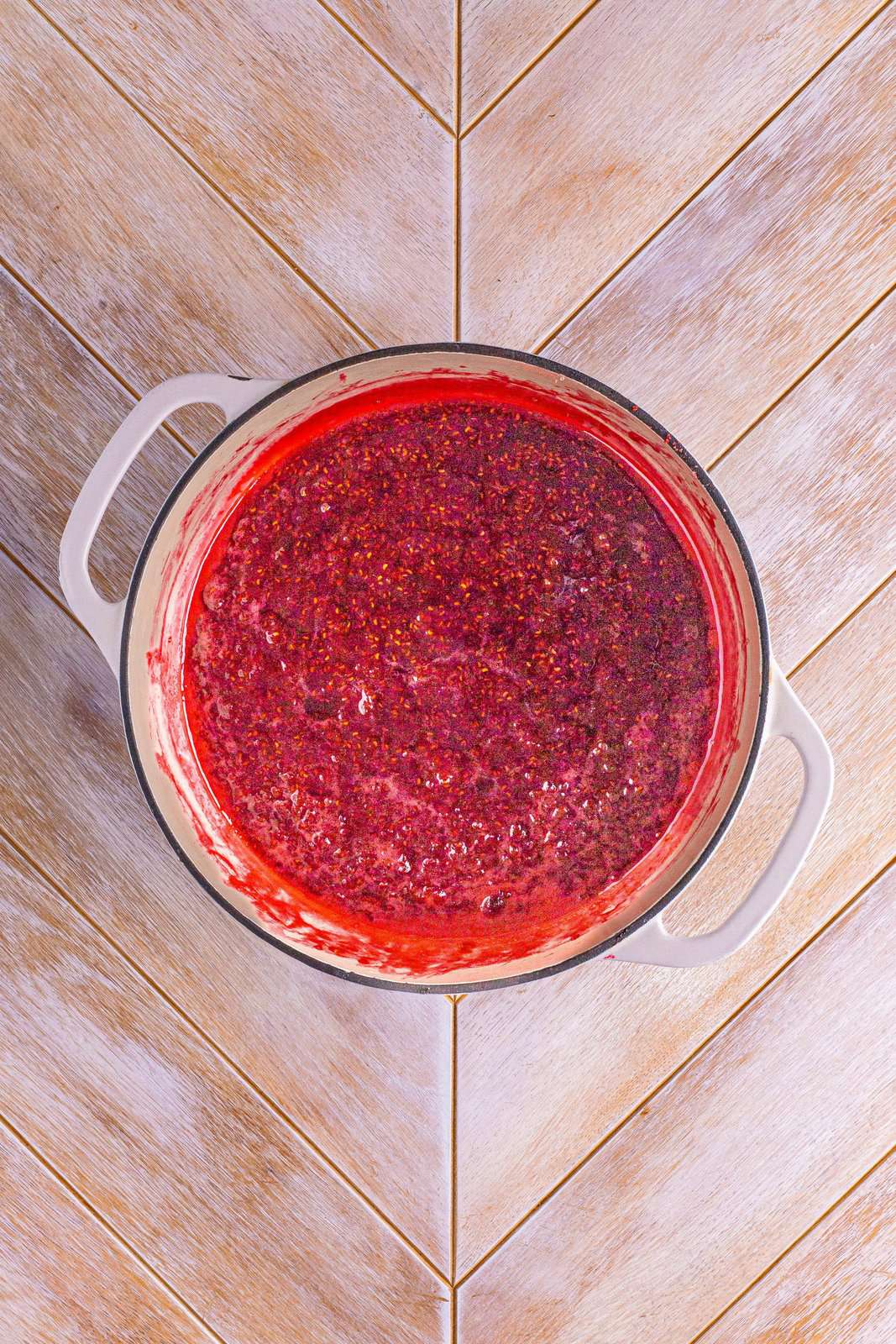 A pot of raspberry jam.