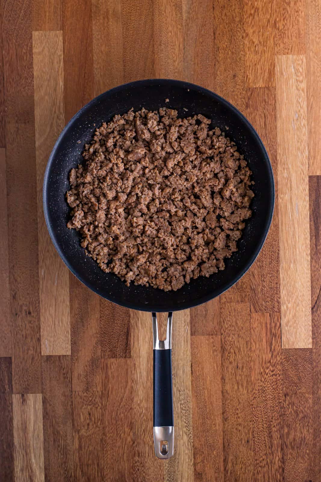 A skillet with breakfast sausage. 