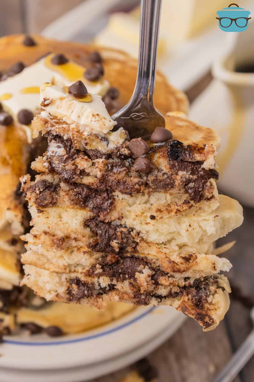 A bite of Chocolate Chip Pancakes on a fork. 