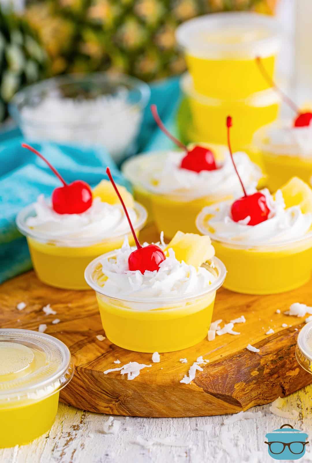 Four Pina Colada Jell-O Shots on a serving tray.
