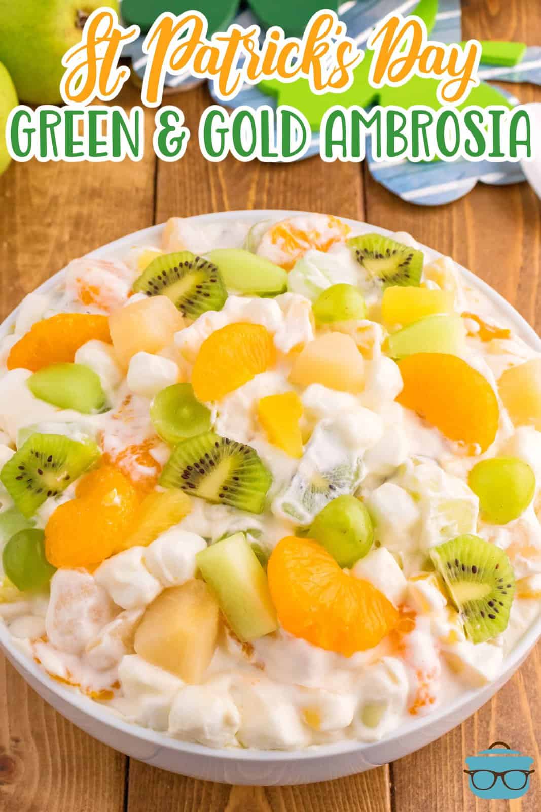 A bowl of Ambrosia salad featuring gold and green ingredients.