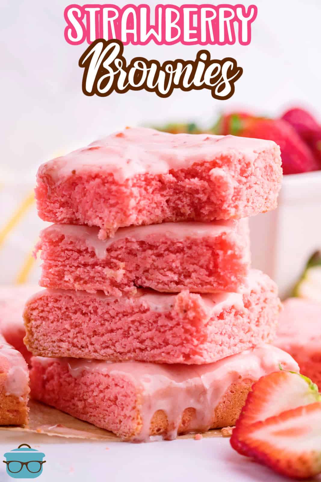 Four homemade strawberry brownies in a pile.