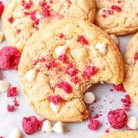 Close up of a Raspberry Cheesecake Cookie with a bite taken out.