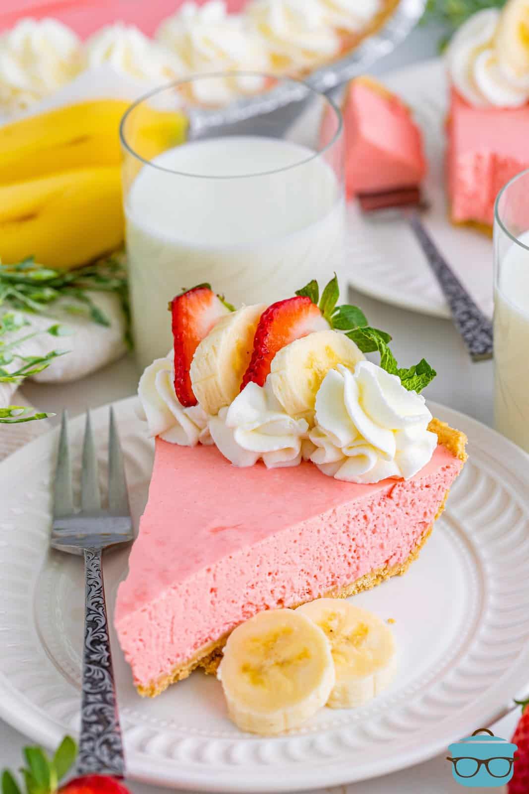 A slice of Strawberry Banana Jello Pie on a plate.
