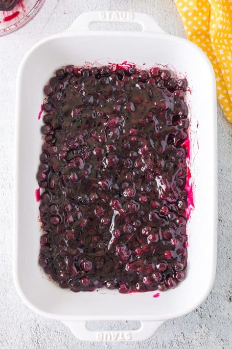 blueberry pie filling added to baking dish