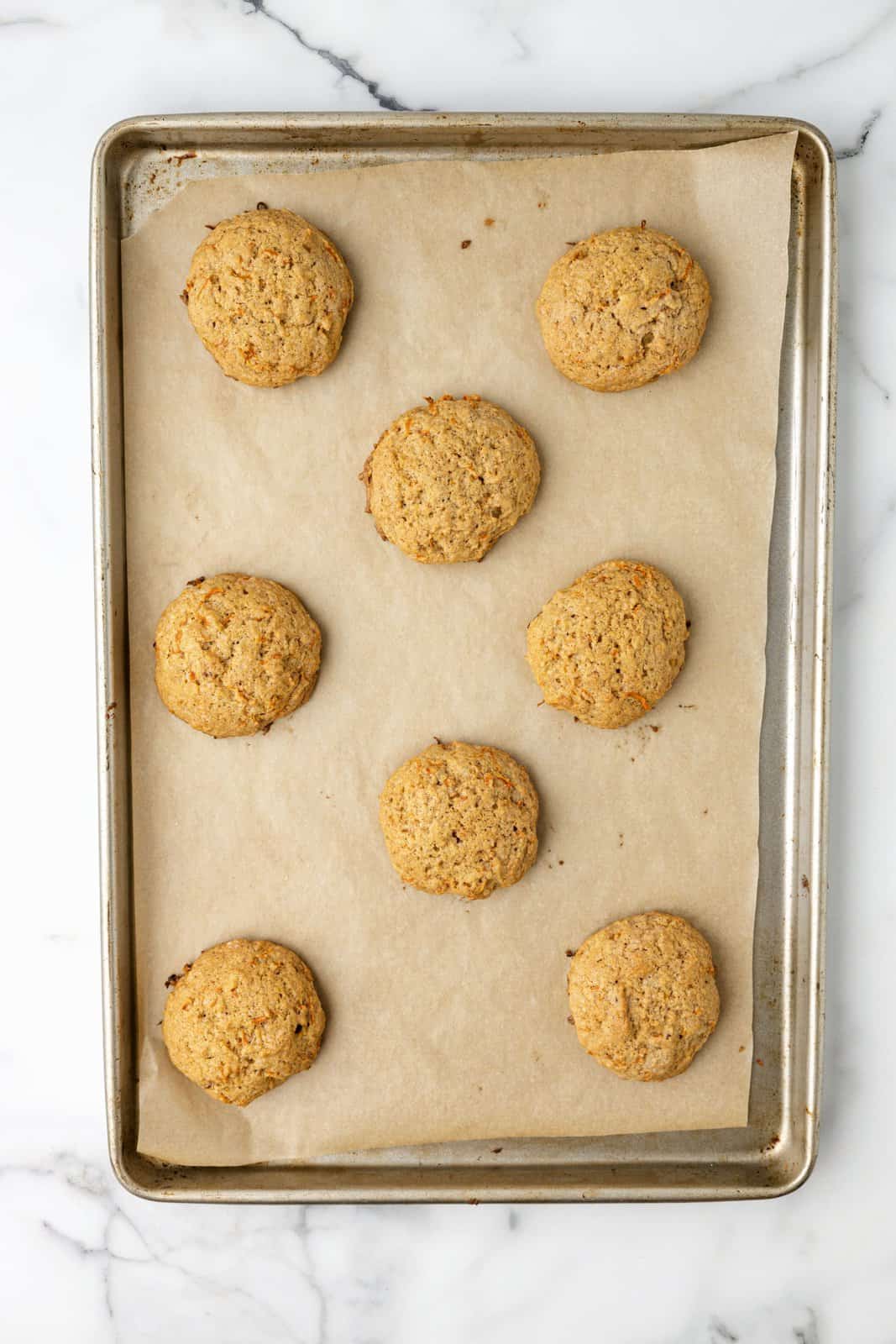 Baked Carrot Cake Cookies on a baking sheet. 
