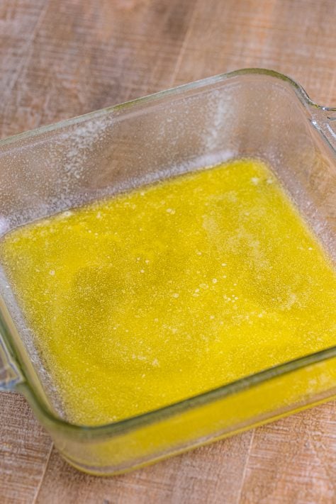 A baking dish with melted butter.