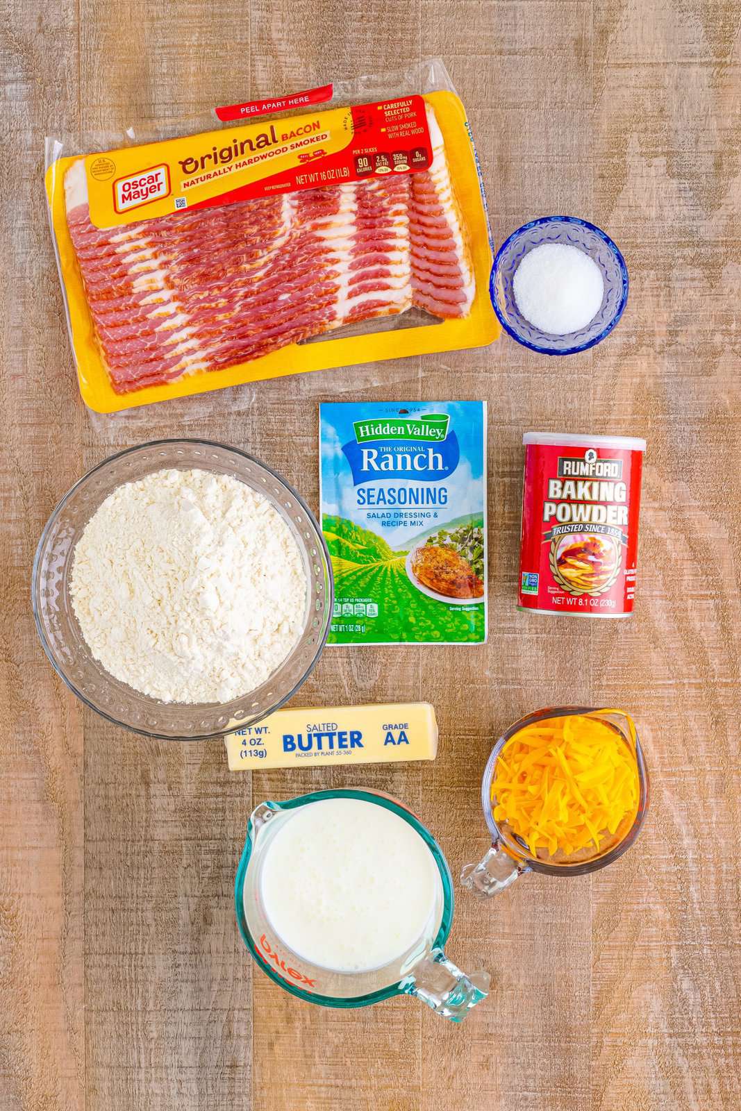 Salted butter,
all-purpose flour,
granulated sugar,
aluminum-free, baking powder,
dried ranch seasoning, buttermilk, bacon, and freshly shredded cheddar cheese.