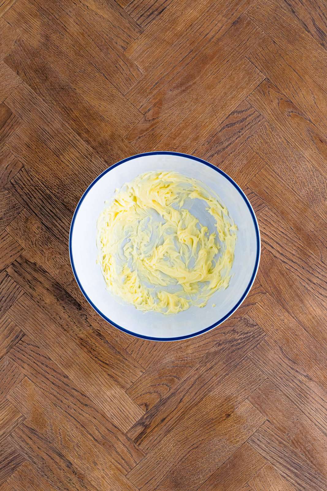 A mixing bowl with whipped butter in it. 