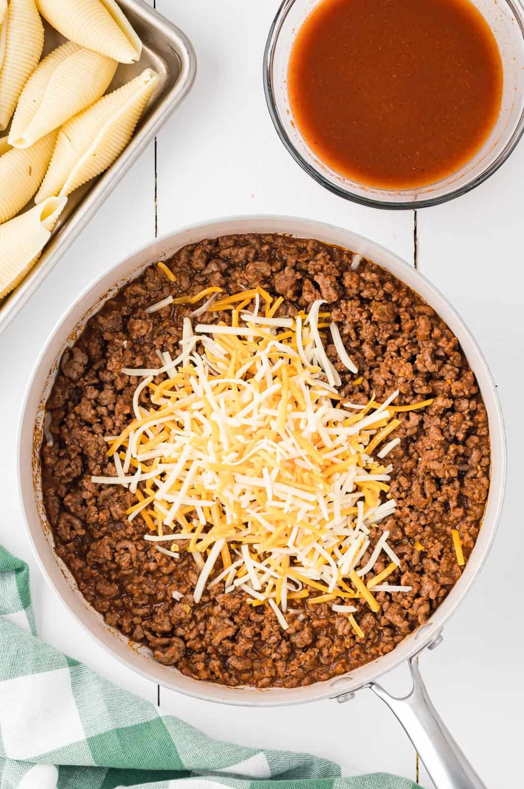 Taco skillet with shredded cheese. 