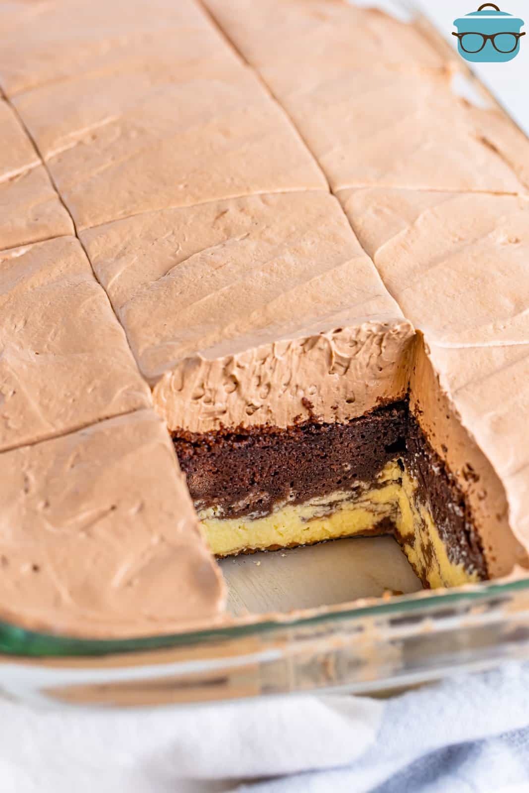 A baking dish with Italian Love Cake that is missing a piece. 