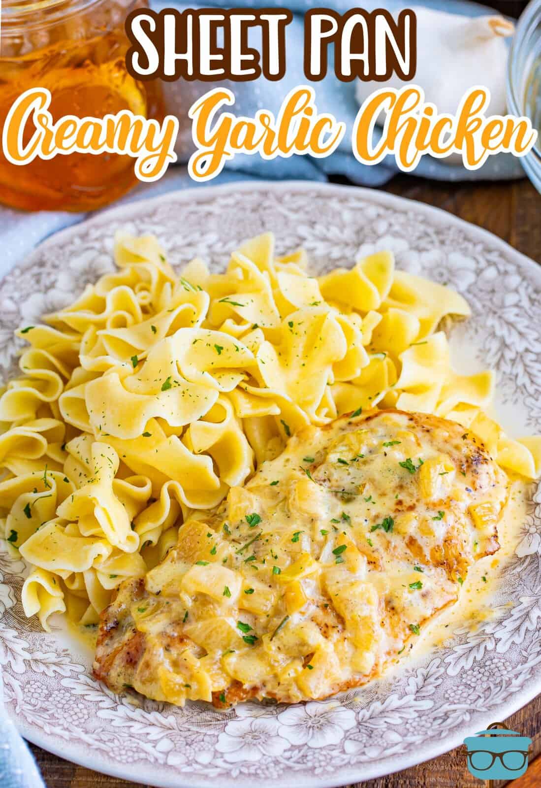 A bed of pasta and a piece of Creamy Garlic Chicken.