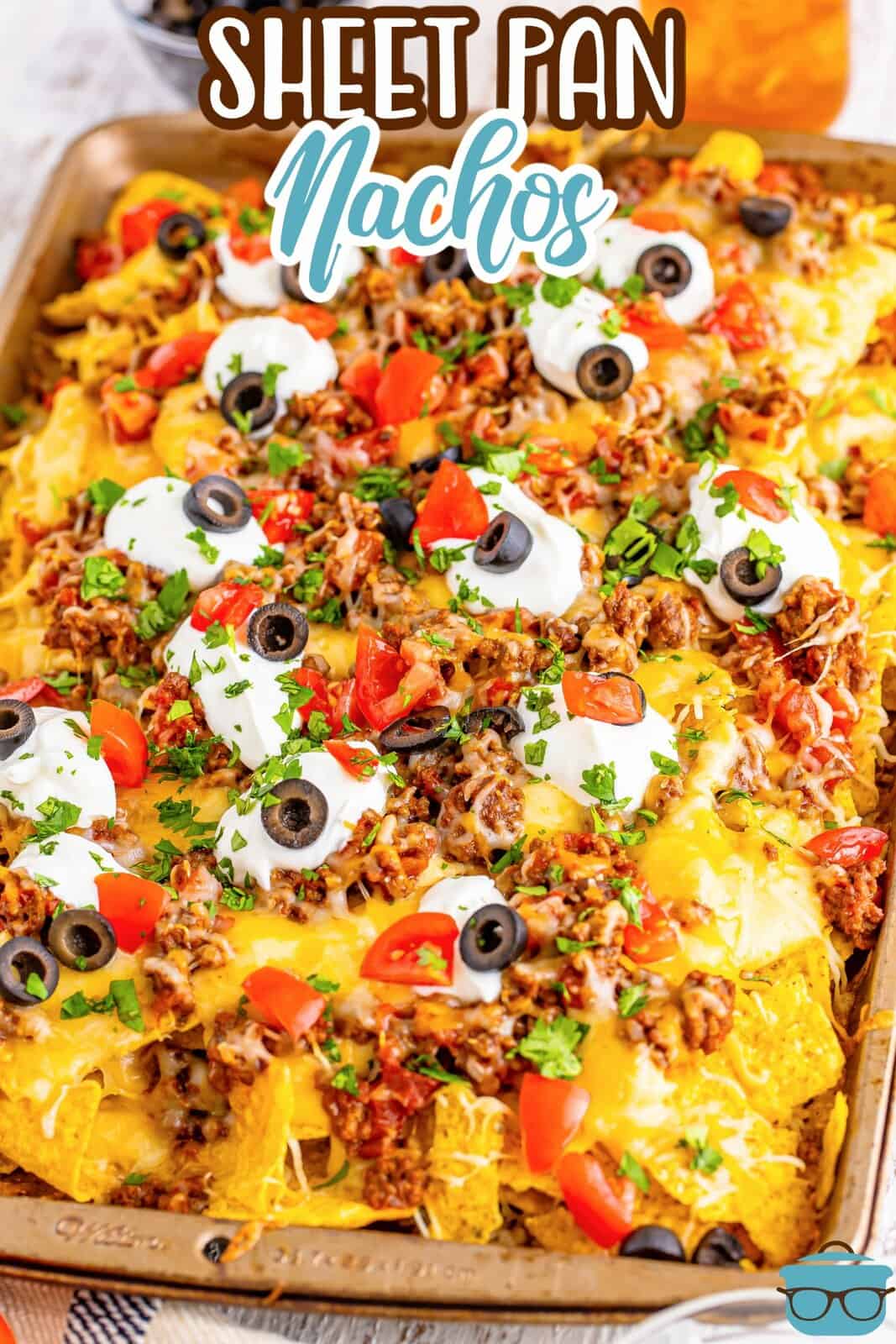 A sheet pan loaded with the ultimate nachos.