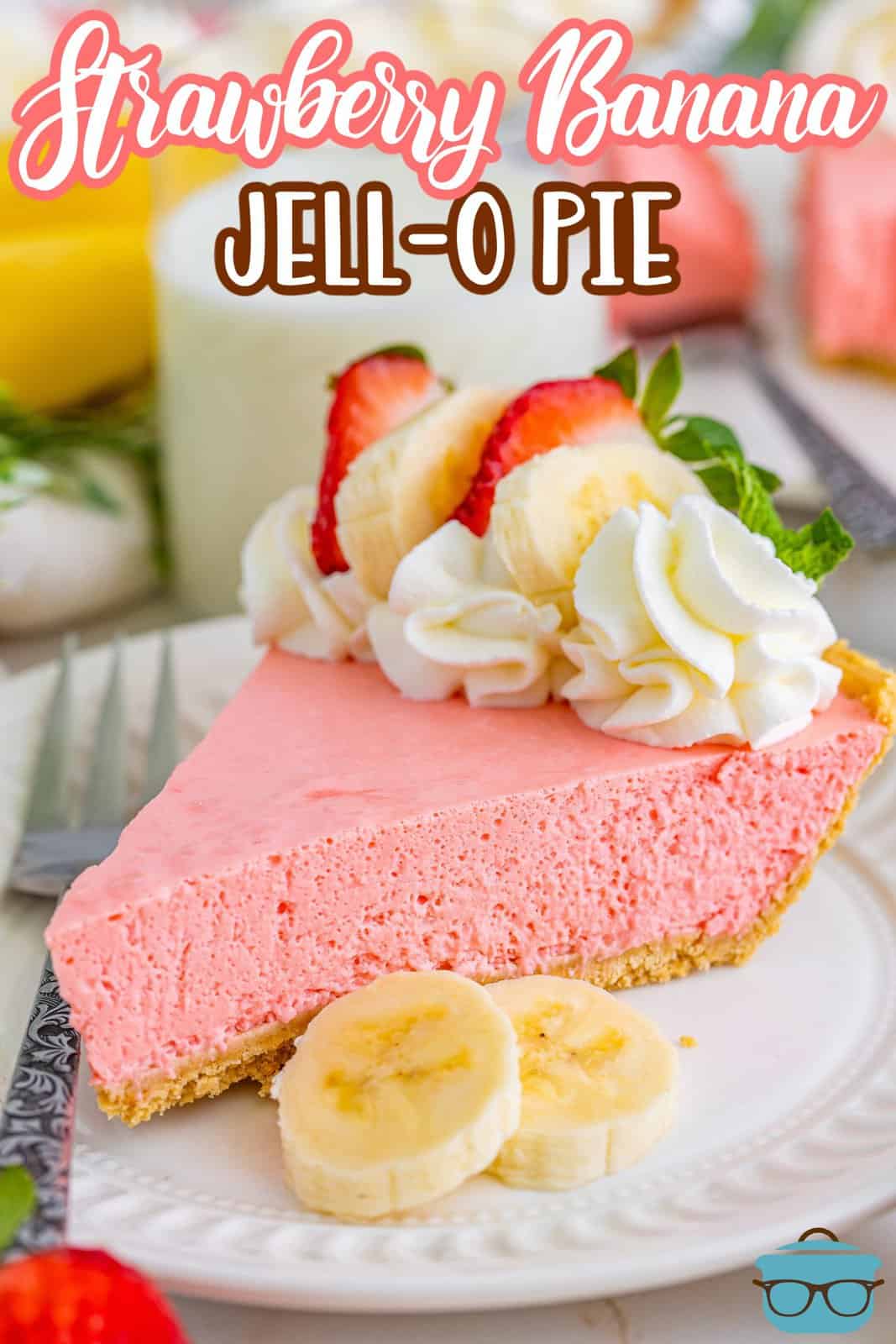 A slice of Strawberry Banana Jello Pie with garnishes on top.