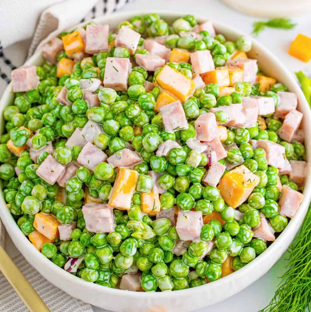 A bowl of ham and pea salad.
