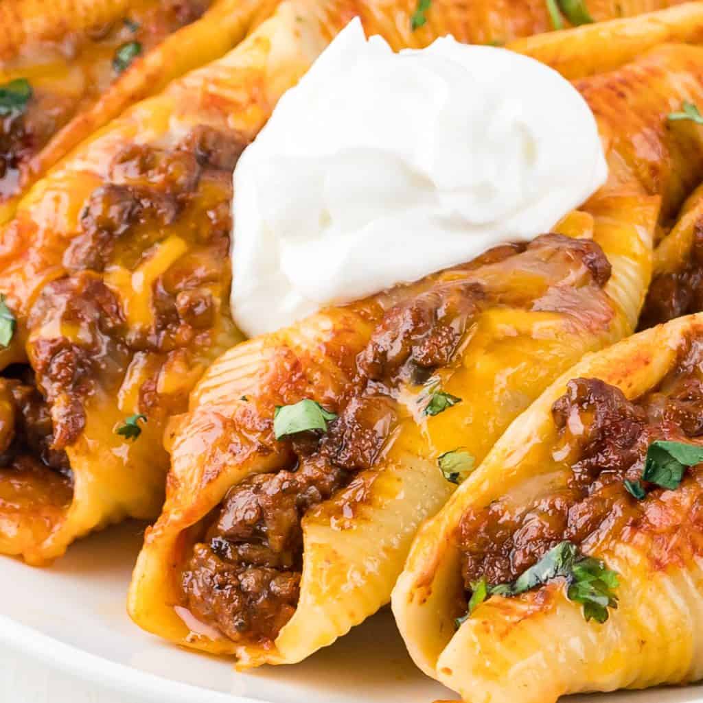 Stuffed shells with taco flavors with sour cream on top.