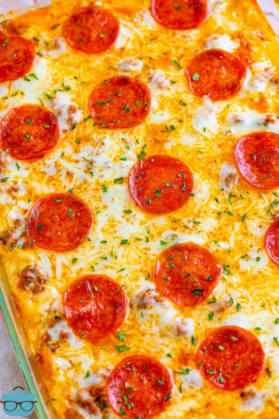 Looking down on a pizza casserole with pepperonis on top.
