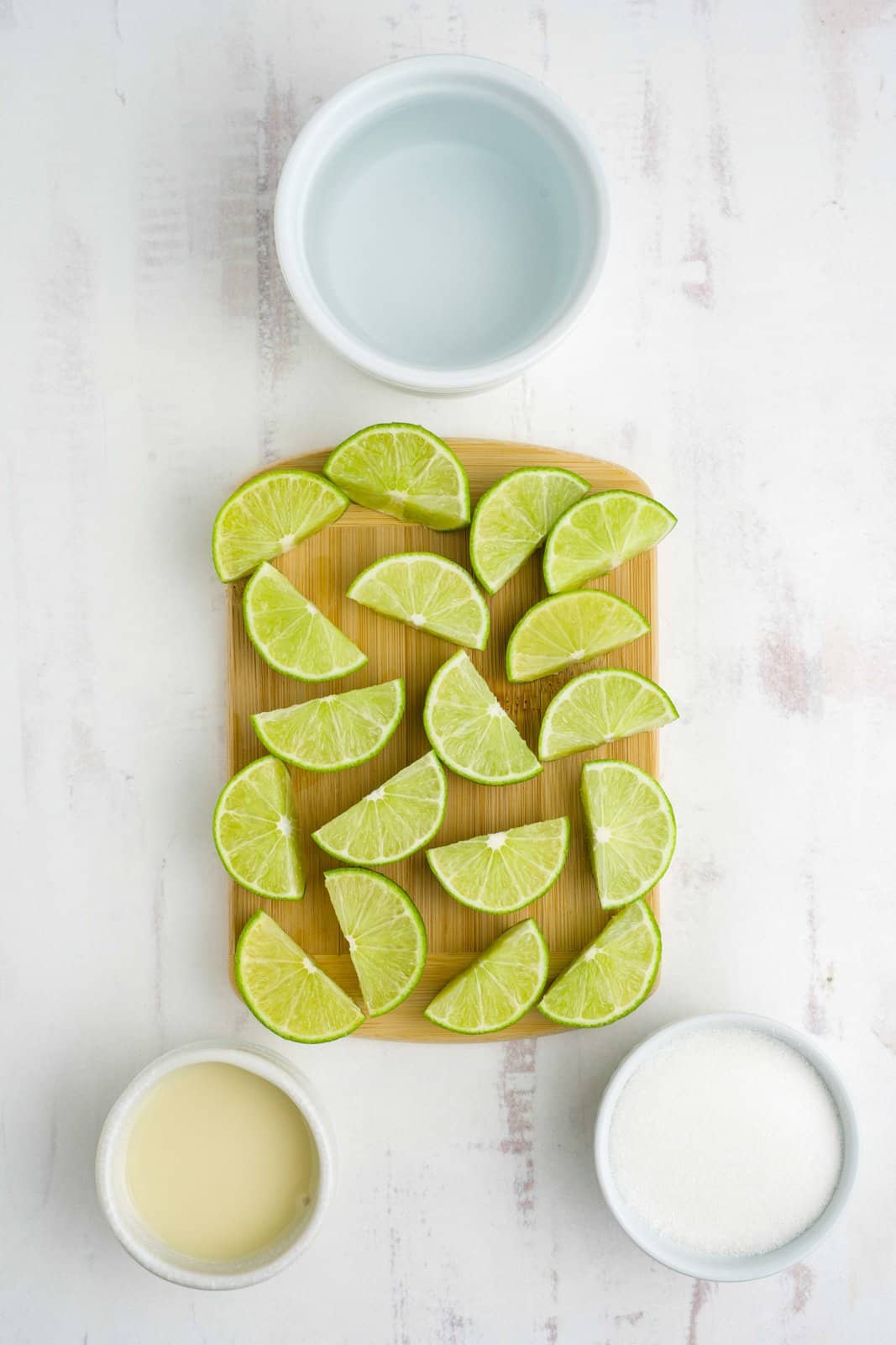 Lime wedges, sugar, cold water, and sweetened condensed milk.