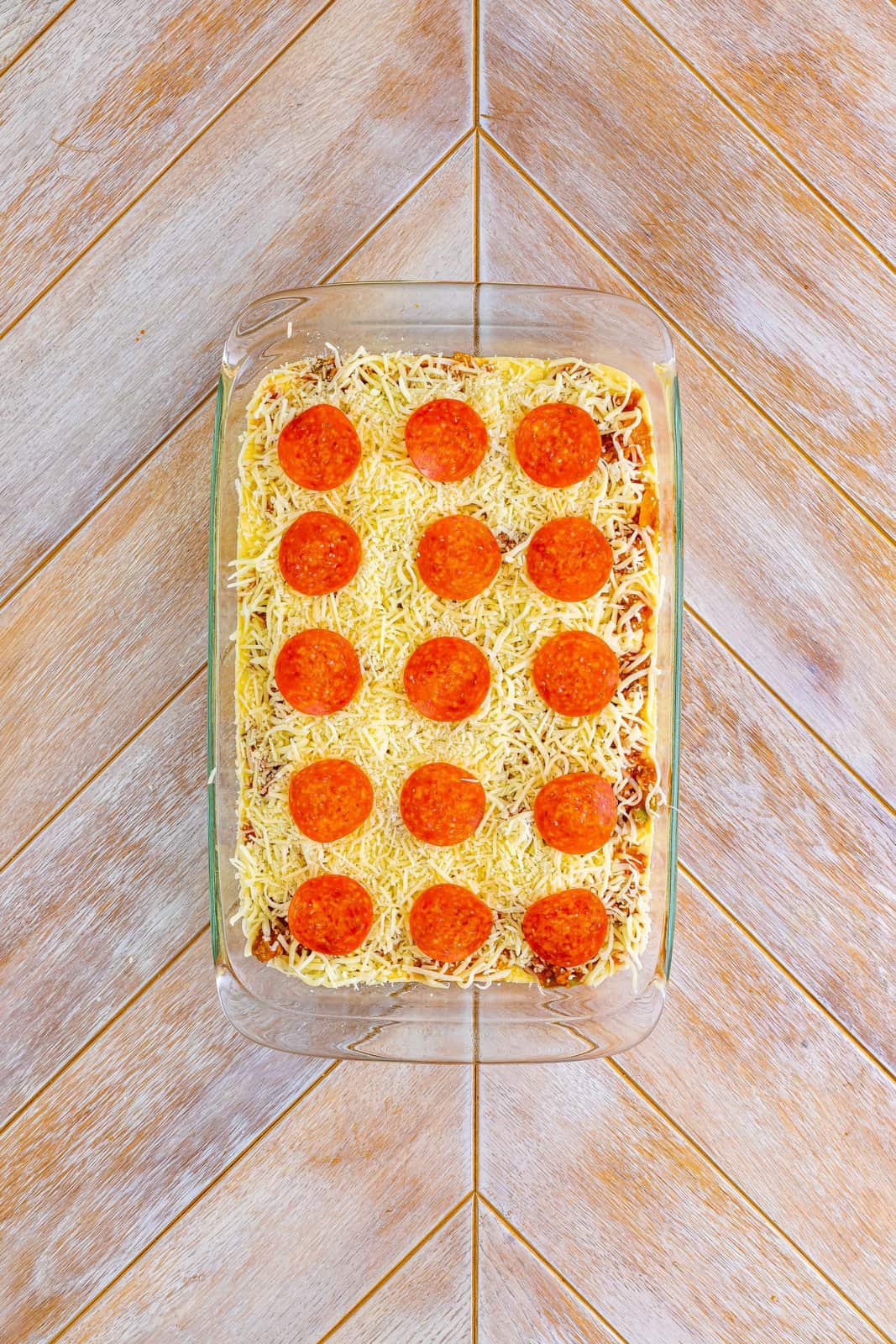 Uncooked puffy pizza casserole. 