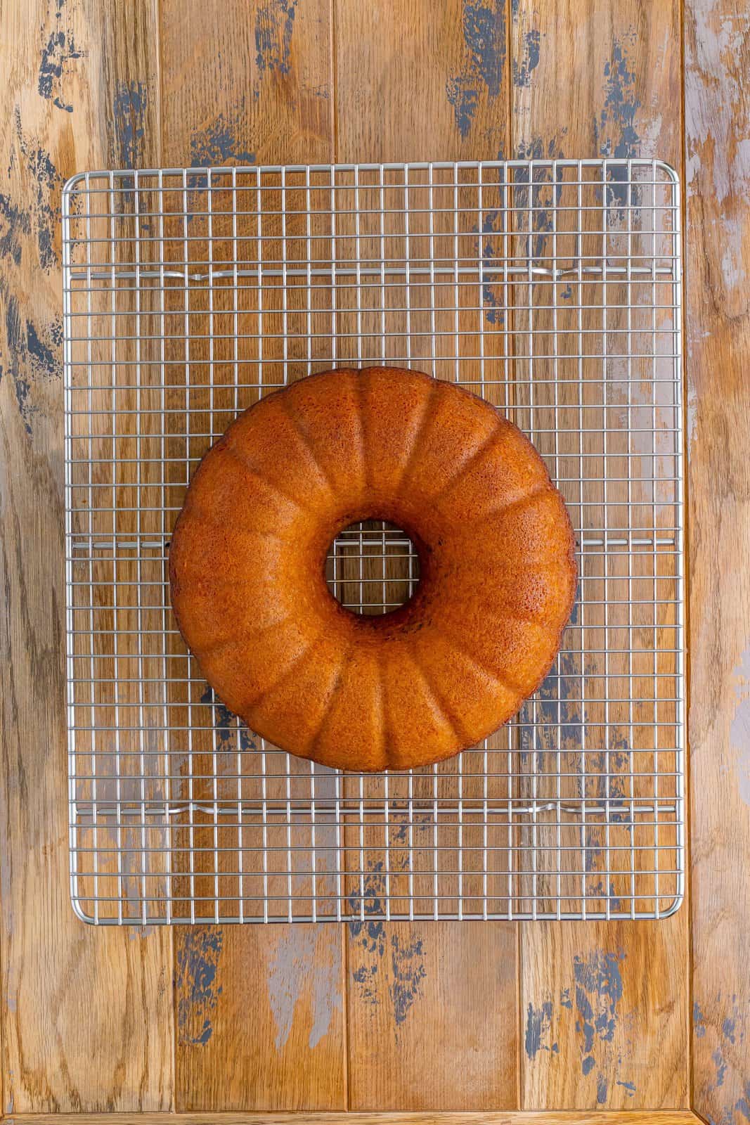 A Sock It To Me Bundt Cake on a wire rack cooling.