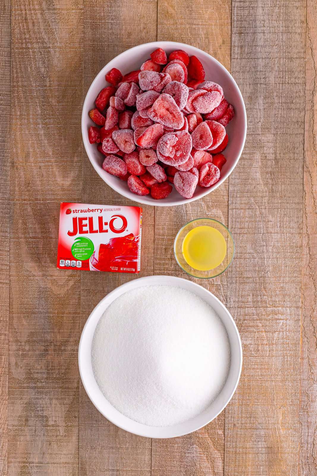 Frozen strawberries, sugar, strawberry Jell-O, and lemon juice. 