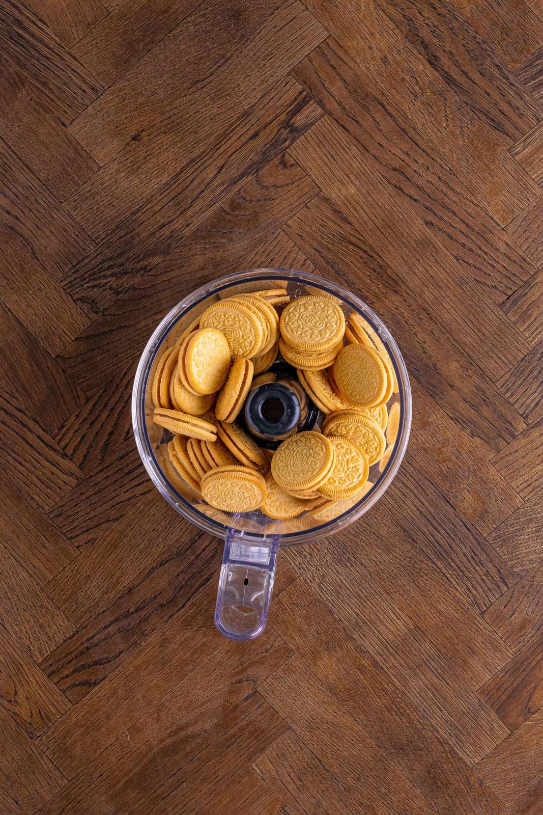 Golden Oreos in a food processor cup.