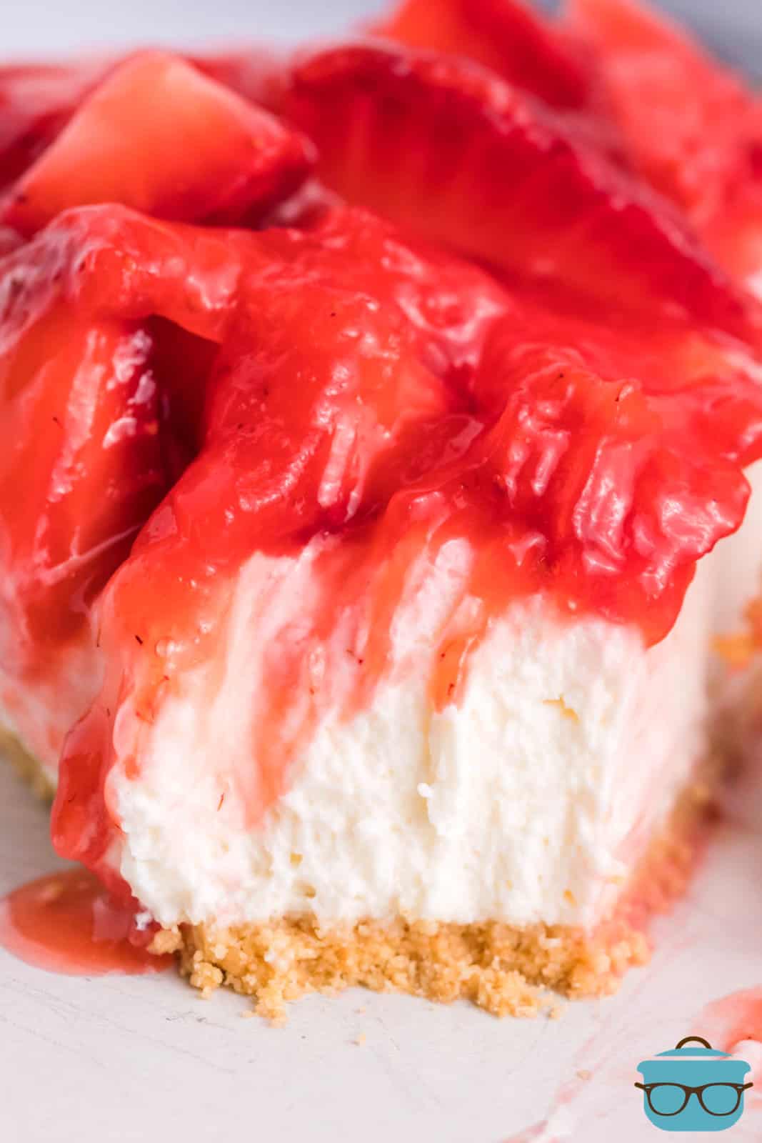 A piece of Strawberry Cream Cheese pie with a bite missing.