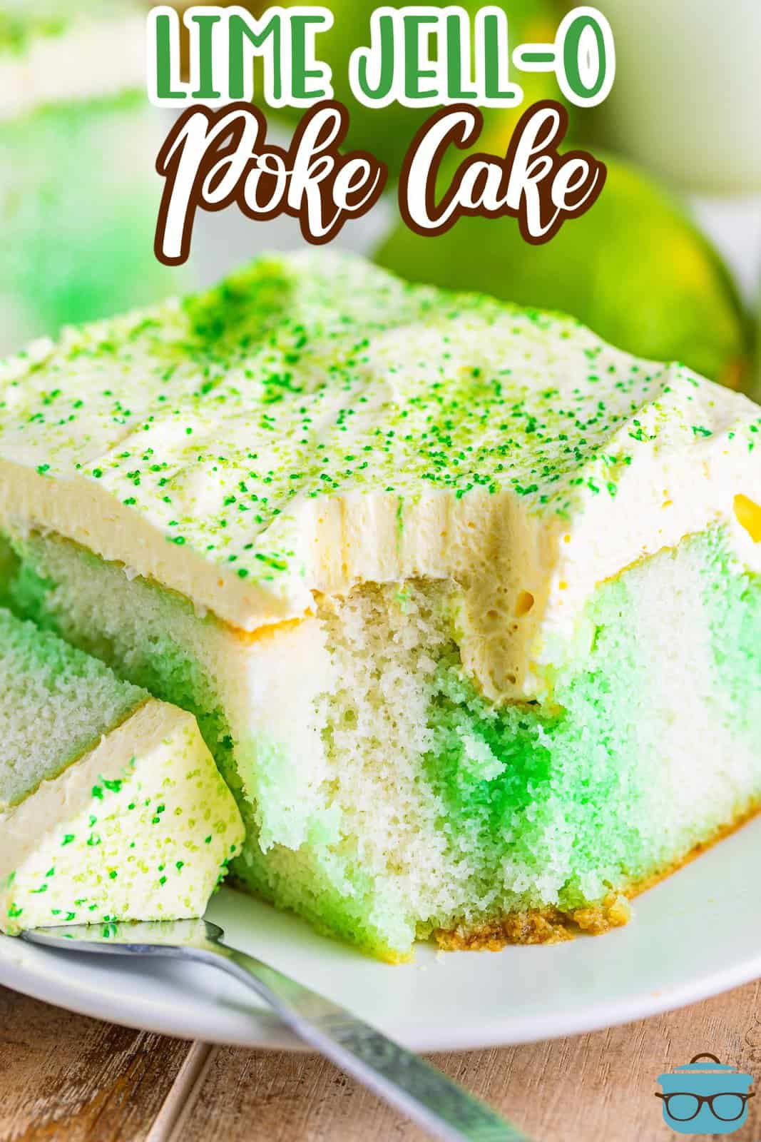 A slice of Lime Jell-O Poke cake with a fork that and a bite missing.