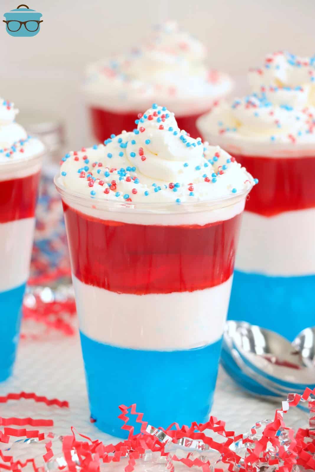 A couple red, white, and blue layered jello cups.