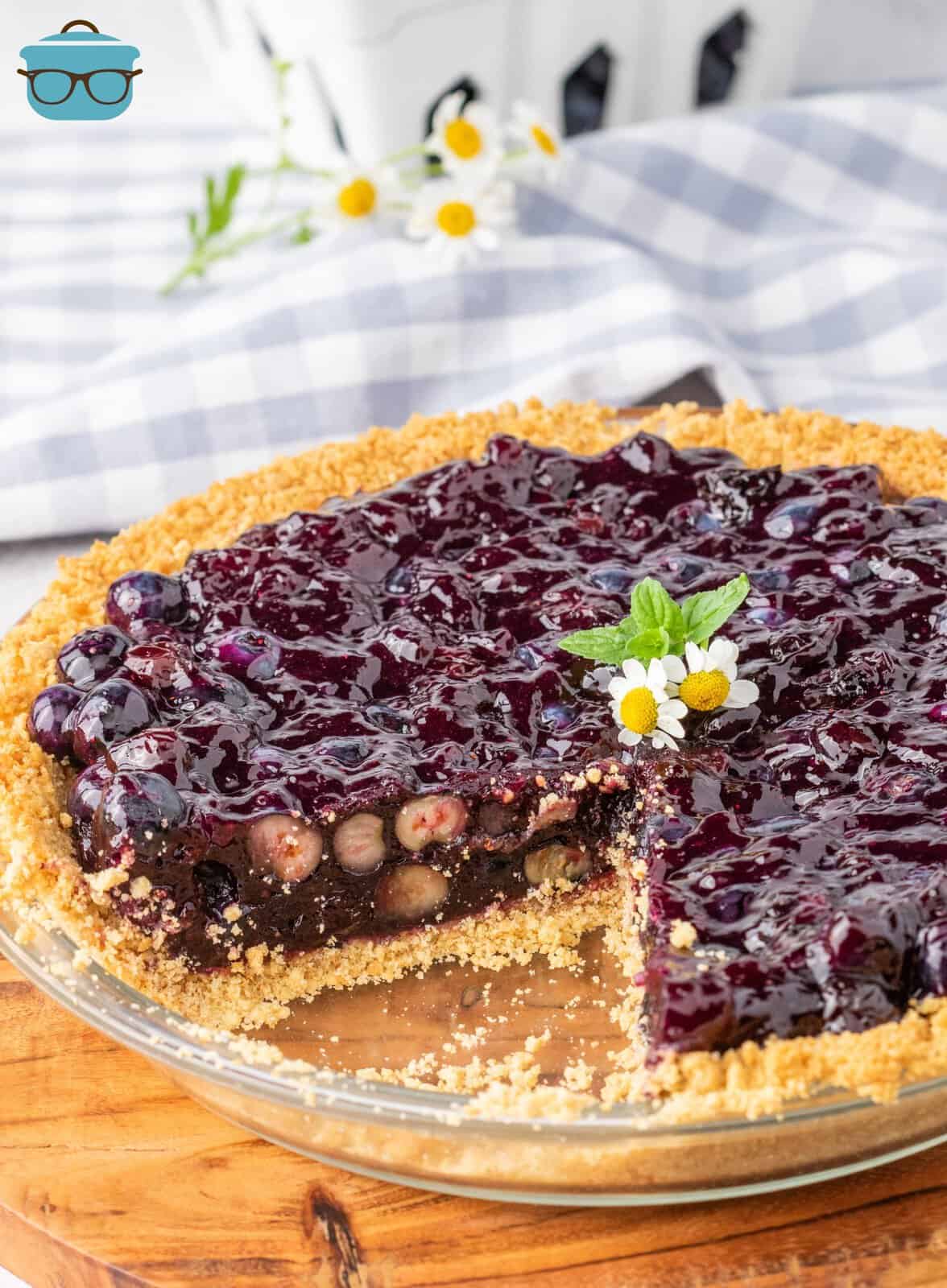 A homemade Blueberry Jell-O Pie with a slice missing.