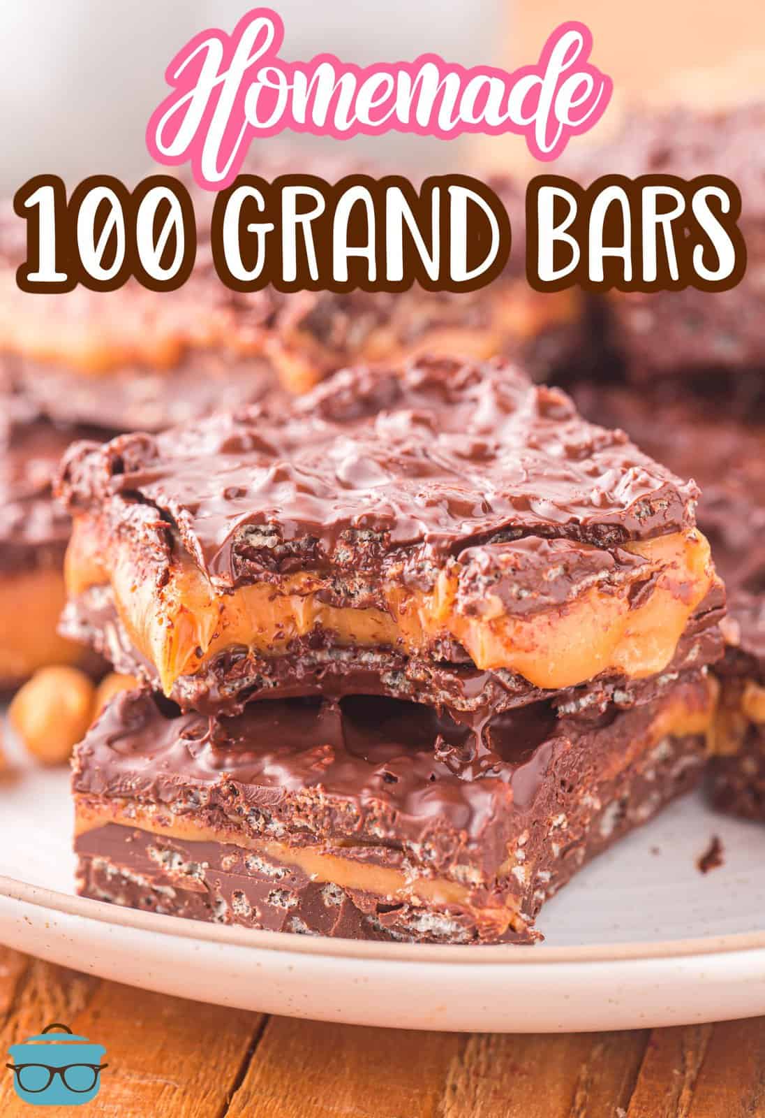 A plate with two homemade 100 Grand Bars, one with a bite taken out.
