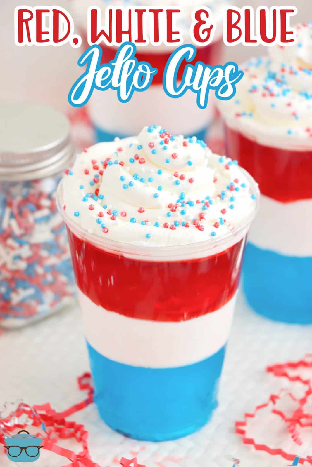 Red, white and blue Jell-o Cups with whipped cream on top.