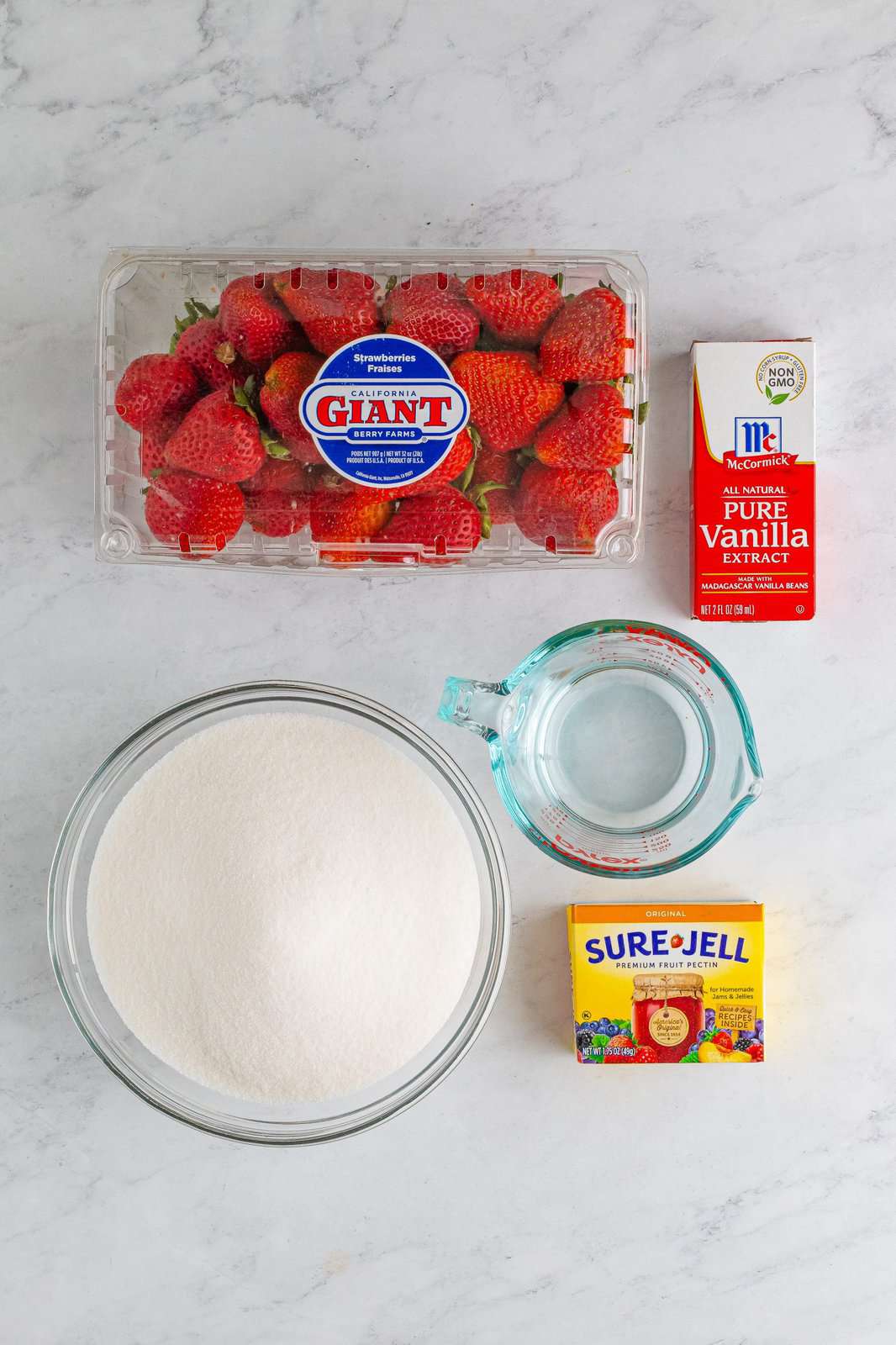 Strawberries, pectin powder, sugar, vanilla extract, and water. 
