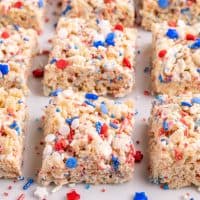 Closely looking at a few 4th of July decorated Rice Krispie Treats.