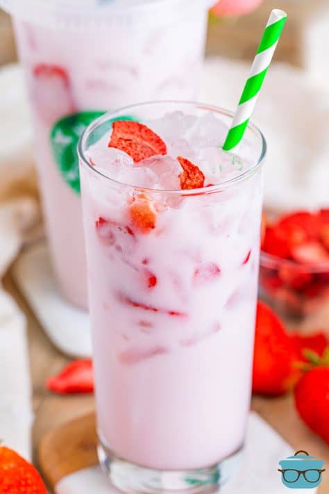 A glass with Pink Drink and freeze dried strawberries.
