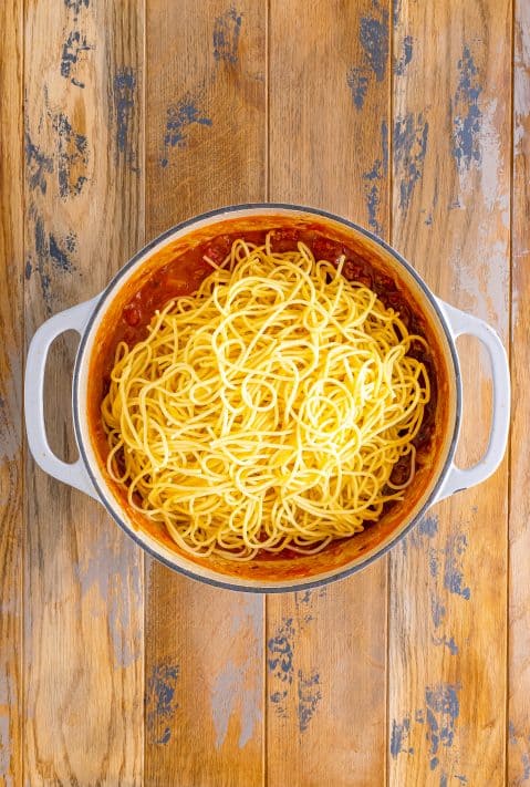 Spaghetti noodles on top of the Cowboy spaghetti sauce.