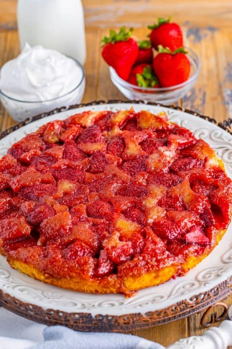 A freshly baked Strawberry Upside Down Cake on a serving plate.