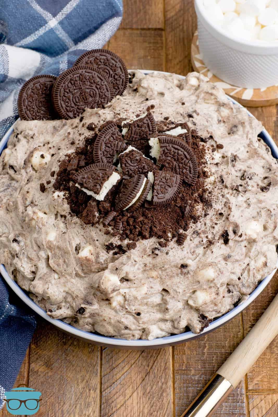 A bowl of Oreo fluff with chocolate oreos on top.