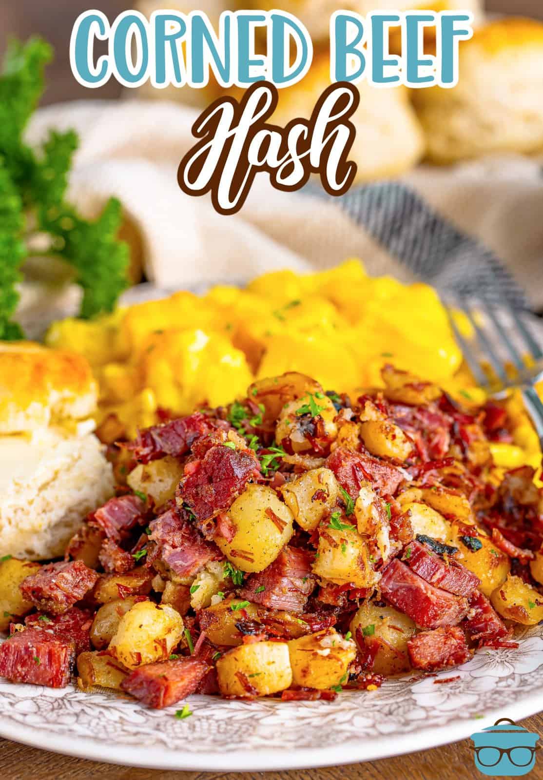 A plate of corned beef hash with other side dishes.