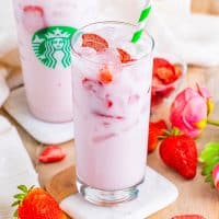 A glass with a Starbucks Pink Drink.