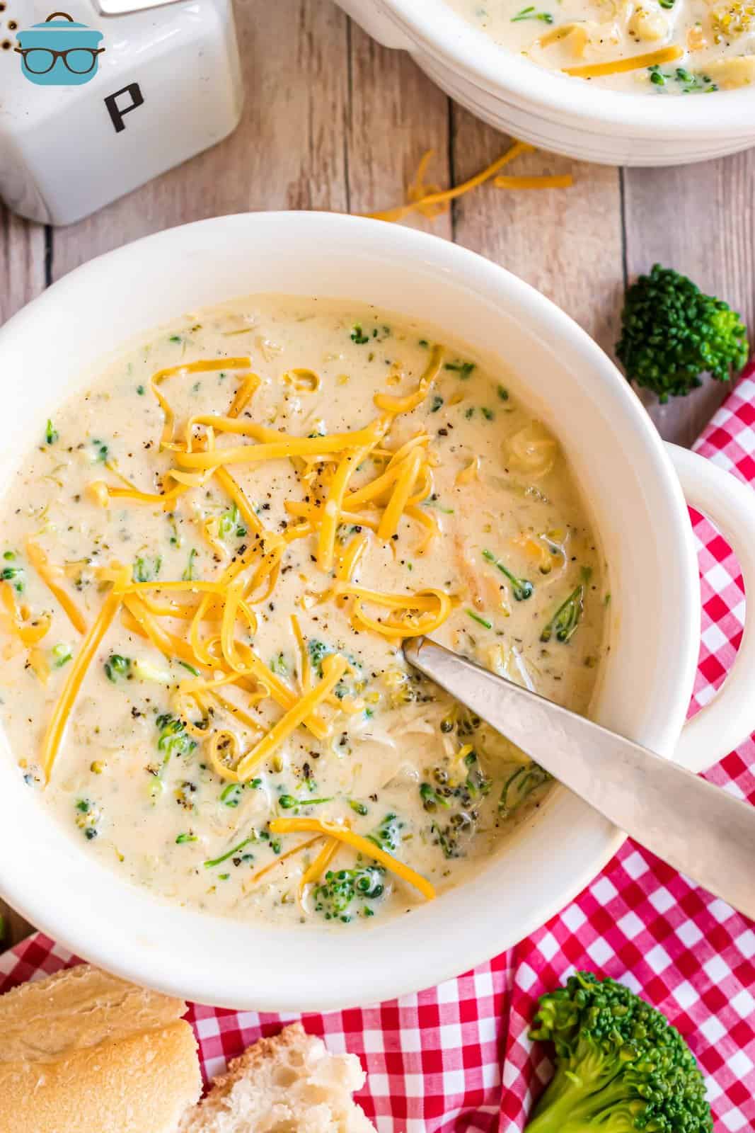 A bowl of homemade Broccoli Cheddar soup from the Slow Cooker with a spoon in it.