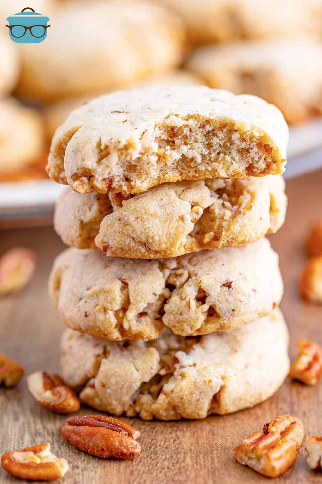 A stack of Pecan Sandies with the top one missing a bite.