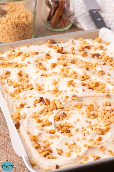 A baking dish of Apple Spice Cake with frosting.